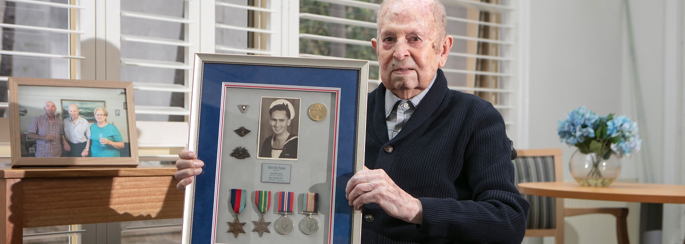 An elderly gentleman with his War medals