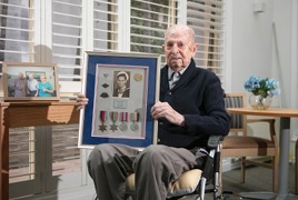 An elderly gentleman poses with his War medals An elderly gentleman poses with his War medals