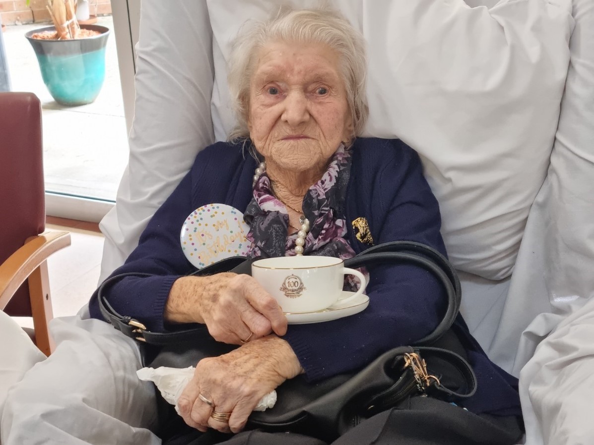 Dorothy Burgess with Bolton Clarke teacup (2)_crop.jpg