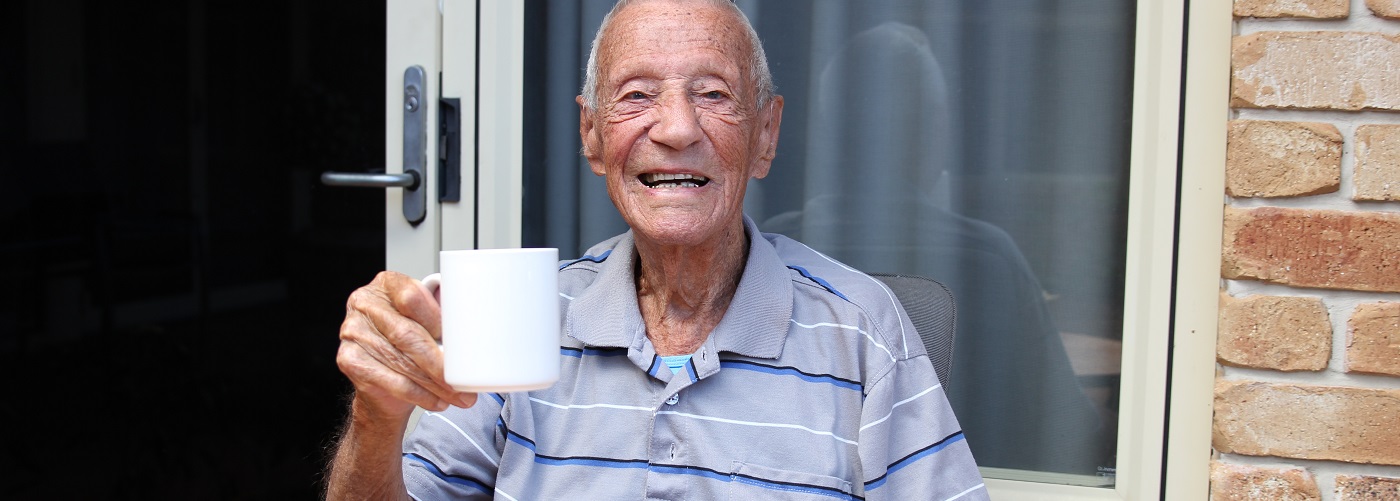 Centenarian George enjoying a cup of tea