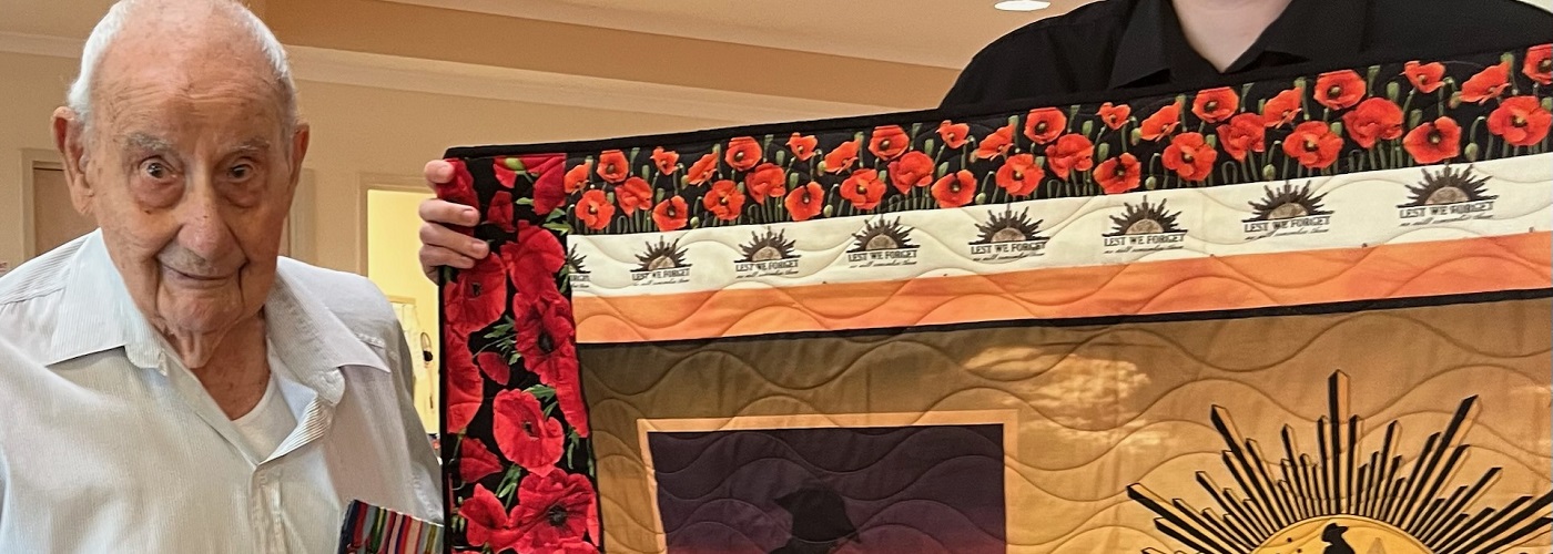 Herbert receiving Quilt of Valour