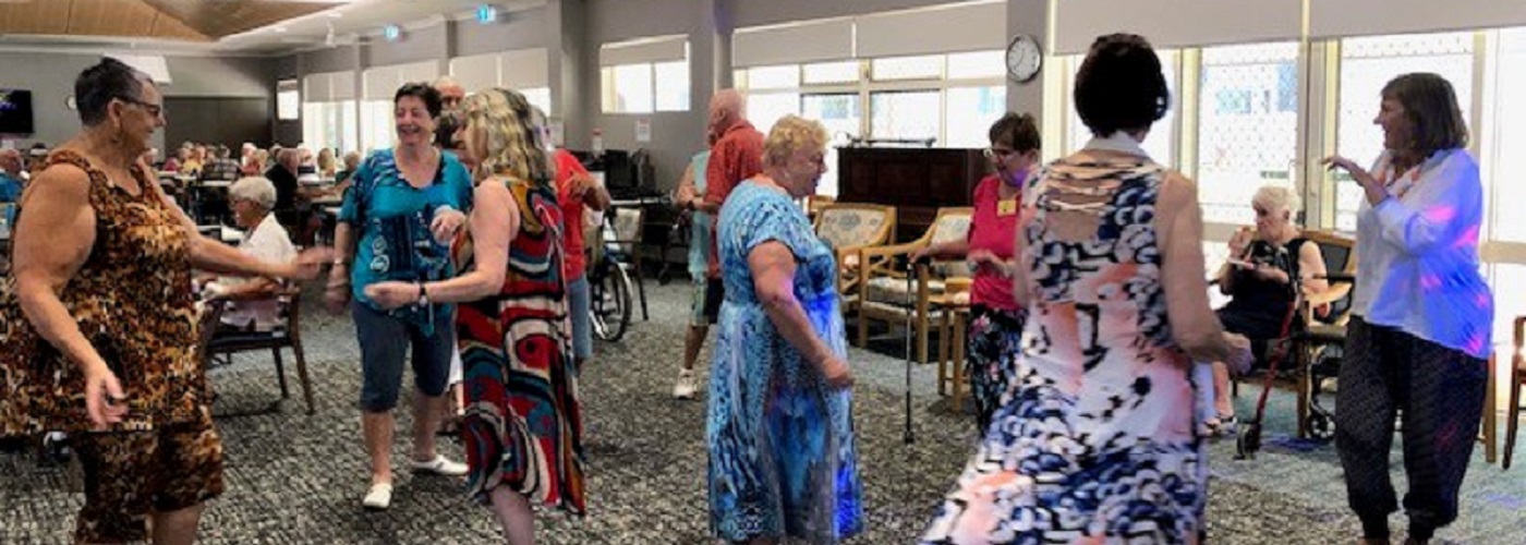 A group of retirement village residents dancing