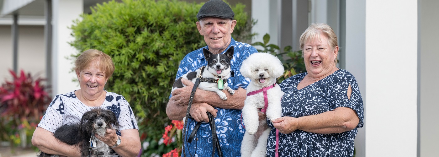 Breezes residents enjoy a stroll with their pups