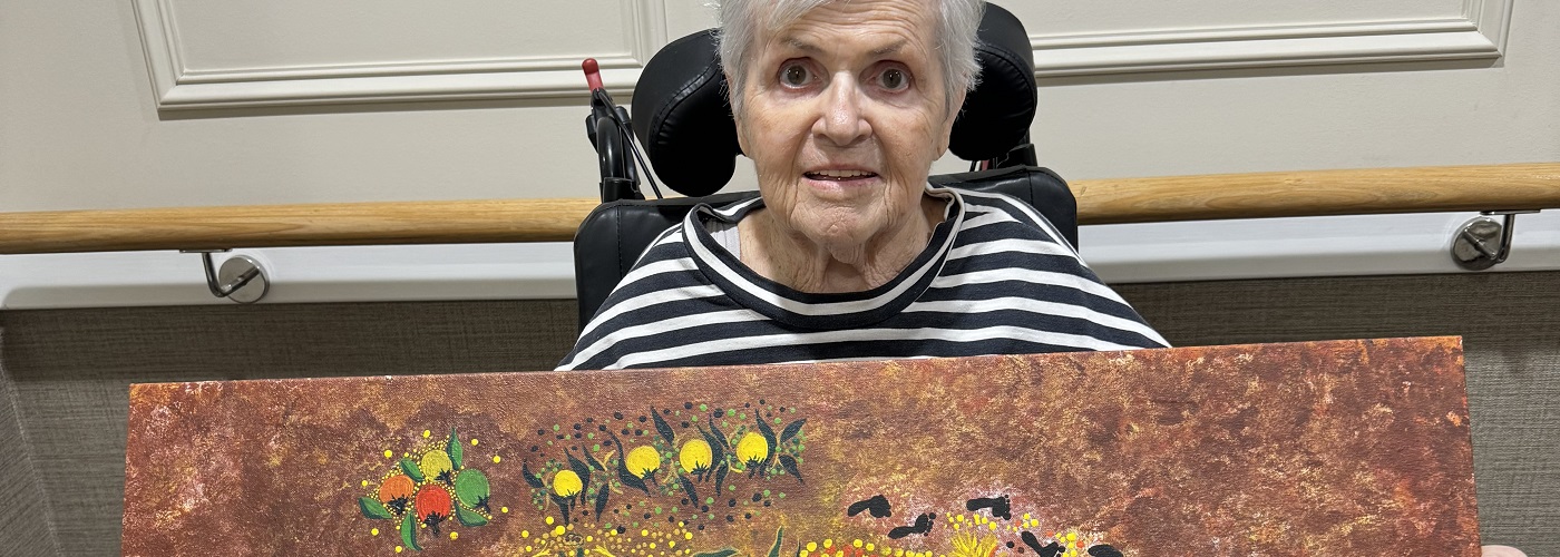 Jenny with one of her gifted paintings.jpg