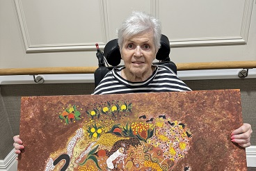 Jenny with one of her gifted paintings_.jpg