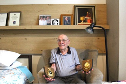 Lewis with his awarded service plaques_.jpg Lewis with his awarded service plaques_.jpg