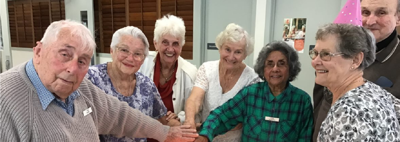The original residents cutting the cake for the Birthday Bash 