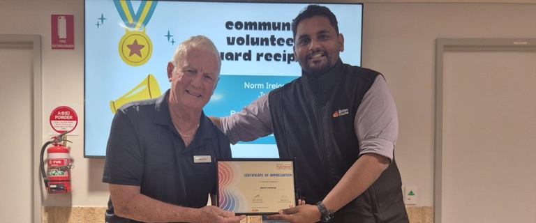 Norm accepting his volunteers certificate.jpg Norm accepting his volunteers certificate.jpg