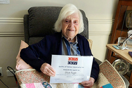 Olive Pugh with her Quilt of Valour and Certificate Olive Pugh with her Quilt of Valour and Certificate